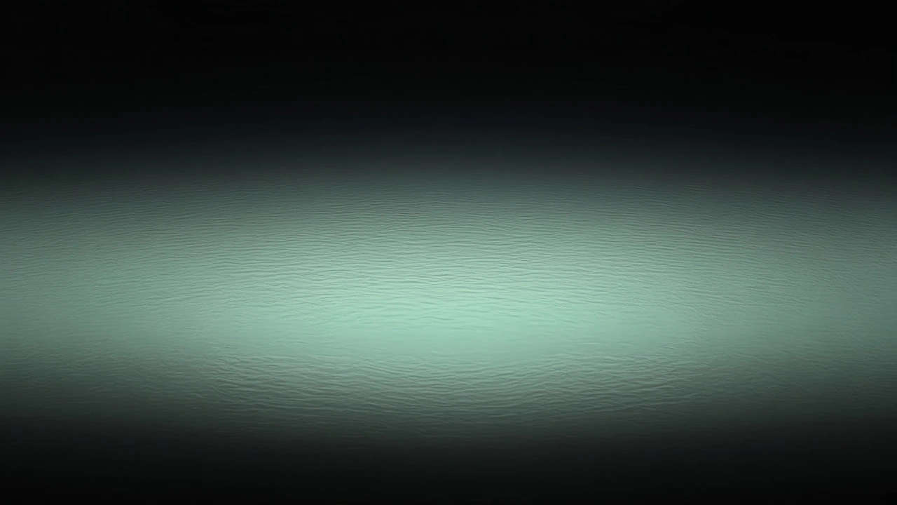 A flat empty sea at noon, pale water into black, with no horizon